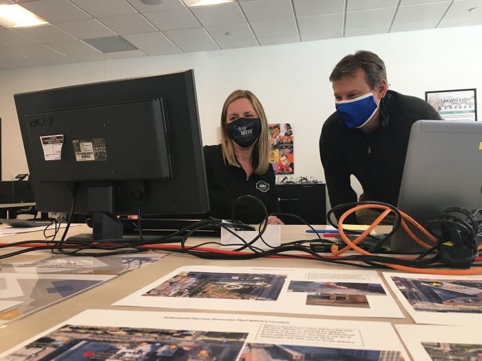 Brian Bowman, right, speaks with Heather Vaughn from the host program's headquarters in downtown Indianapolis.
